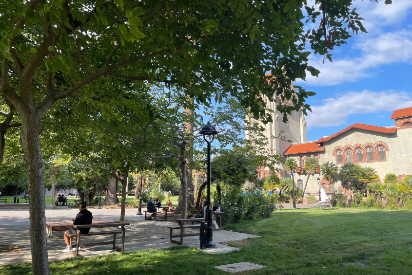 Convertible benches line pathways around Tower Lawn. These benches also serve as tables when converted.