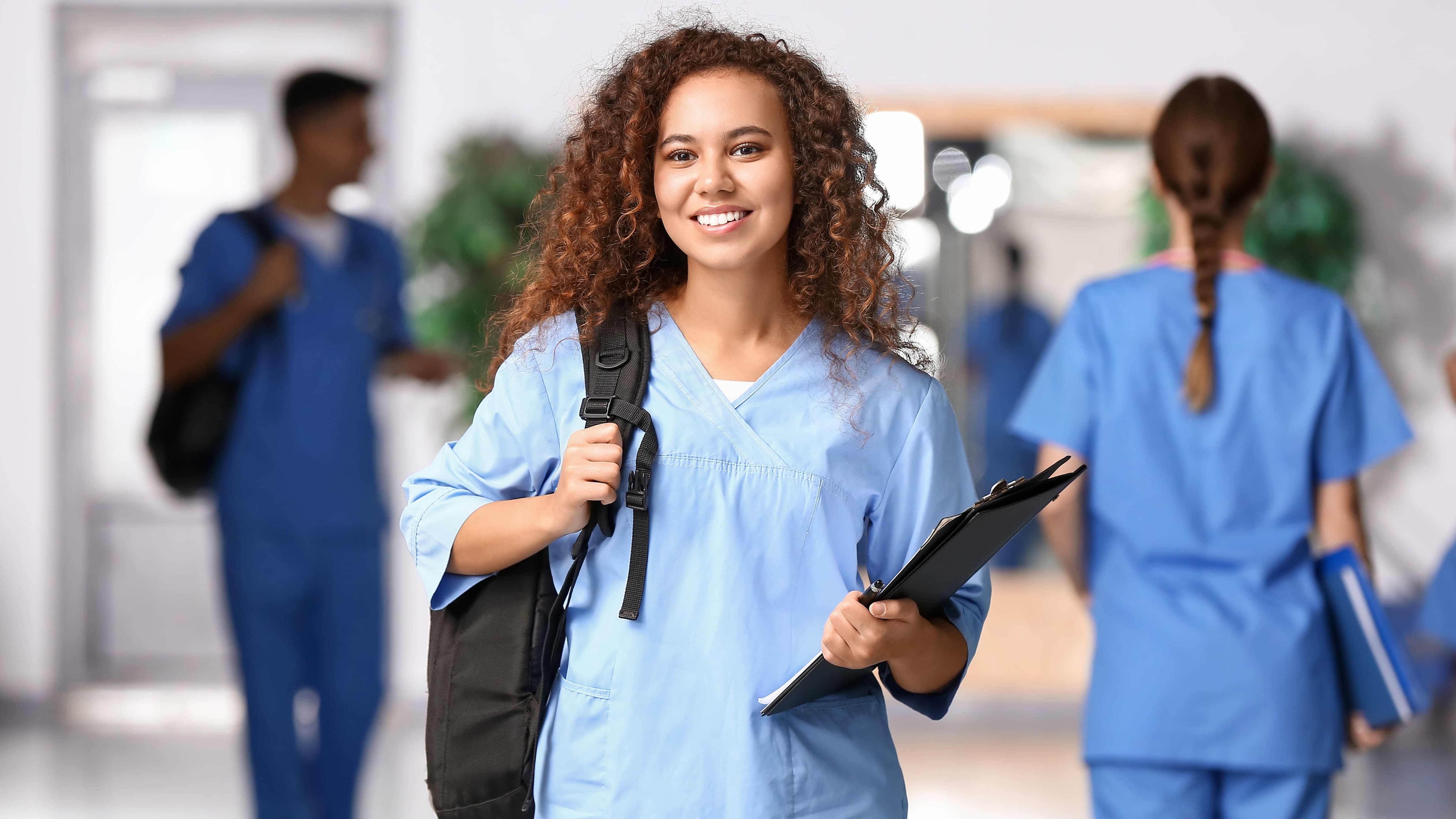 Public health student wearing scrubs