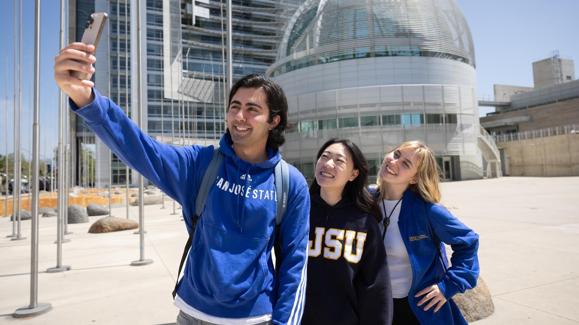 Group of students taking a selfie in front of San Jose city hall